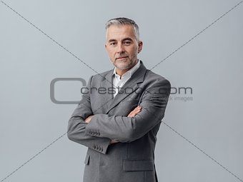 Confident businessman posing