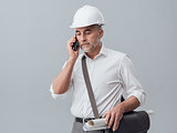 Construction engineer using a smartphone