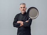 Chef posing with a pan