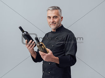 Chef choosing a wine bottle