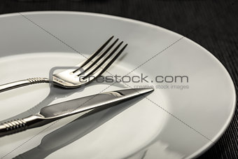 Fork and knife on plate