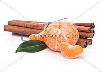 Fresh organic mandarin fruit with raw cinnamon