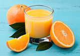 Glass of organic fresh orange juice with fruits