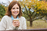 Happy Attractive Middle Aged Woman Drinking Coffee