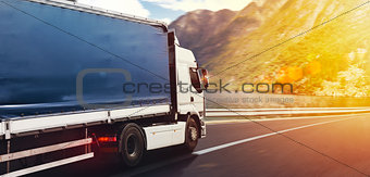 Truck run fast on the highway to deliver