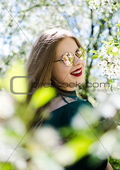 Beautiful happy girl in the spring in the fresh air 