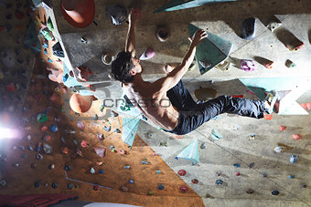 man climber climbs indoors