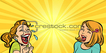 Two cheerful girlfriend girls laugh