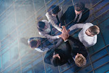 Business people putting their hands together. Concept of integration, teamwork and partnership. double exposure