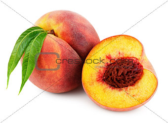 Peach with half and leaves isolated on white