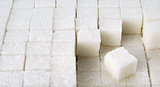 cubes of white sugar in a row