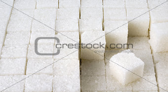 cubes of white sugar in a row