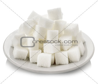 Cubes of white sugar in a white saucer