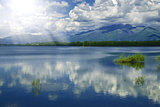Art Photography.Idyllic summer landscape with clear mountains and water...