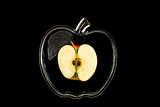 sliced apple in a glass bowl on a black background