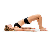 young girl doing exercises in underwear on a white background