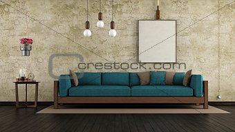Living room with old wall and wooden sofa -