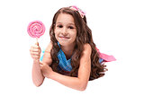 Delicious sweetness. Multicolored lollipops. Little girl