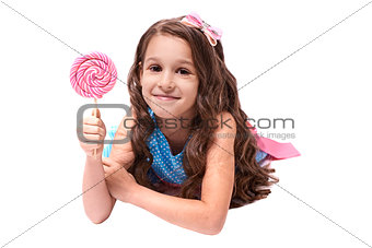 Delicious sweetness. Multicolored lollipops. Little girl
