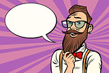 Stylish bearded hipster with glasses thinks