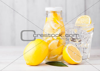 Glass bottle of lemon still fruit water 