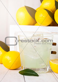 Glass of organic fresh lemon juice with fruits
