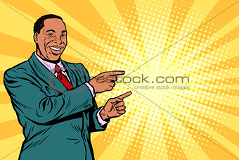 African businessman pointing finger at the side
