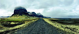 Barren roads along the green landscape of Iceland