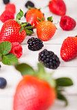 Freash organic healthy berries on wood background
