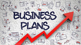 Business Plans Drawn on White Brick Wall.