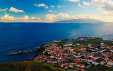 Aerial view to Vila do Corvo and Flores island at sunset, Corvo island, Azores, Portugal