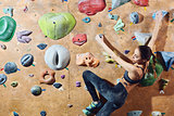 woman climber climbs indoors