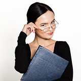 young beautiful Asian businesswoman wearing eyeglasses with folder for papers