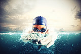 Athlete swims in a blue deep water