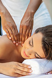 Woman At Health Spa Having Relaxing Massage