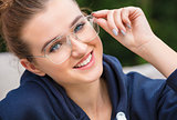 Beautiful Young Woman Outside Wearing Glasses