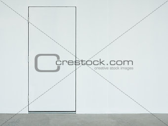 A closed white door on the white wall.