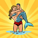 Couple in love. Mermaid and handsome male swimmer
