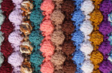Vertical bobble crochet stitches, multi-coloured wool striped ba