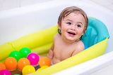 Cute baby boy bathing