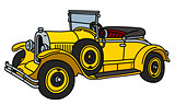 The vintage yellow roadster