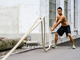 Fitness training outdoors with ropes