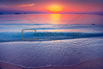 The sand shore and the ocean. Sunset. Thailand.