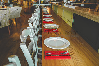 Close-up view. The row of the chairs and tables.