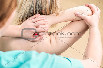 Manual massage of the shoulder joint