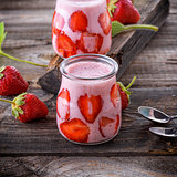 smoothies of fresh strawberries and yogurt in a glass jar 