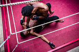 High angle view of African American fighter punching his opponent