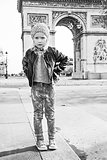 Full length portrait of elegant child near Arc de Triomphe