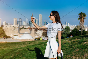 Young attractive woman taking selfie