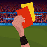 Referee holding red and yellow card